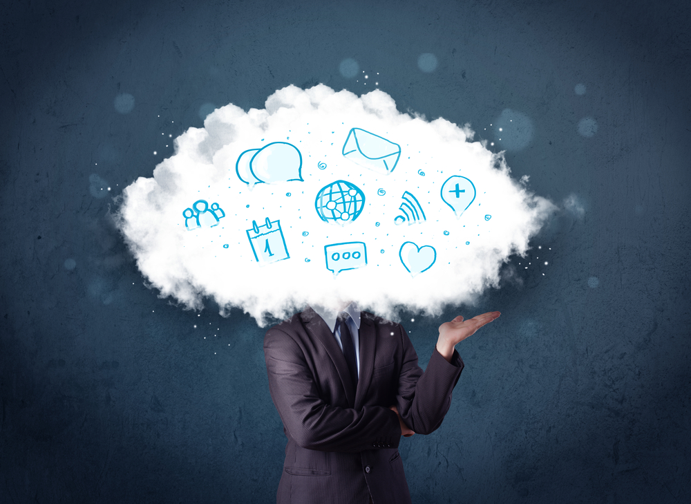 Business man with cloud over his head filled with various thoughts